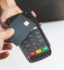 NFC contactless payment by credit card and pos terminal at gun shop